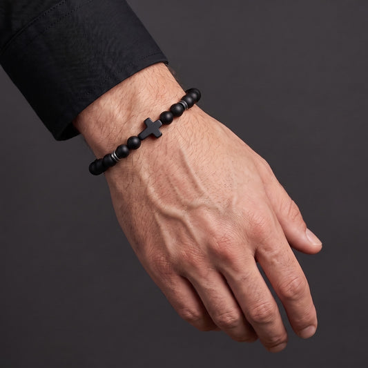 Obsidian Devotion Cross Bracelet worn on the wrist - Allora Jewellery